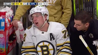 Adam Lowry delivers a clean hard hit on Charlie McAvoy