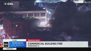 Commercial building fire continues to rage at textile warehouses in downtown LA