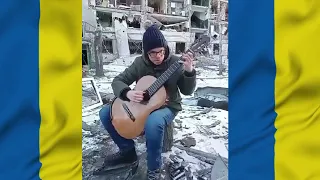 Performance of the song "Dearest Mother of Mine" among the ruins of a house in Kharkov.