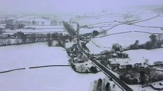 Heavy snow blankets parts of the UK causing travel disruptions