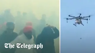 Indian police drop tear gas with drones as farmers march on New Delhi