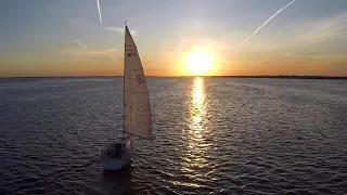 Magical Sea Sunset over a Boat Free Drone Stock Video 4K