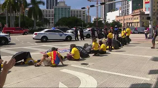 Several protesters calling to end deportation of Haitians arrested after blocking entrance to Po...