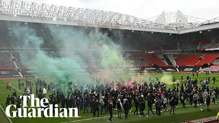 'Glazers out': Manchester United fans take to Old Trafford pitch during protest