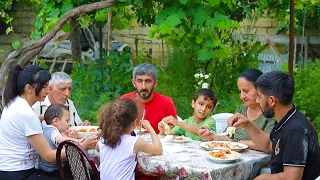 Grandma Cooking Khinkal with Homemade Chicken and Dovga with herbs from her garden