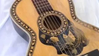 Old vintage parlour guitar