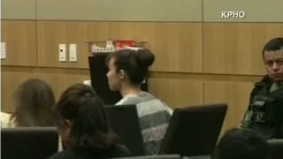Jodi Arias in court wearing prison stripes
