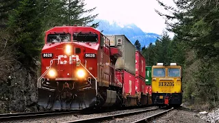 Colorful CPKC Double Stack Meets Herzog Work Train At Yale On The Cascade Sub