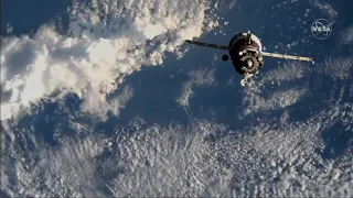 Soyuz docks to space station with NASA astronaut and 2 cosmonauts aboard