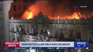 Massive fire rips through top floor of Harlem apartment building