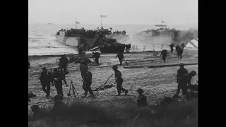 British commandos of No. 1 Special Service Brigade land on SWORD Beach at H plus 45 hrs on D-Day.