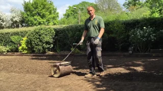 How To Strip an old mossy lawn add new topsoil then lay new turf