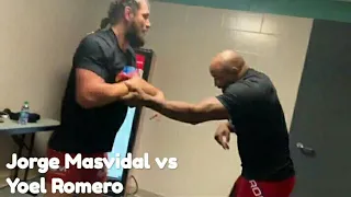 Yoel Romero & Jorge Masvidal wrestling with each other.