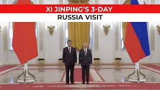 Russian President Vladimir Putin welcomes Xi Jinping to the Kremlin with pomp