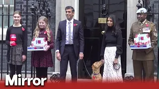 Rishi Sunak and wife don poppies outside 10 Downing Street