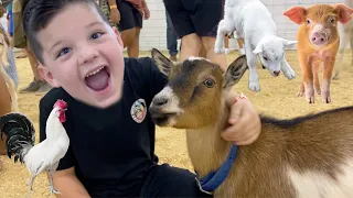 FEEDING FARM ANIMALS! CALEB and MOMMY LEARN ABOUT FARM animals at the KIDS PETTING ZOO at the FAIR!