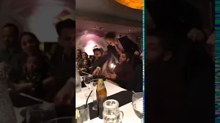 A waiter spills the birthday cake