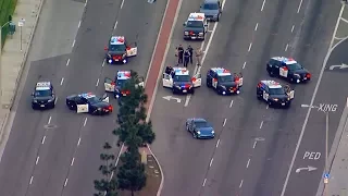 Chase ends in crash, standoff on busy Santa Ana street | ABC7