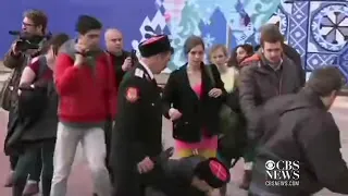 Pussy Riot attacked with whips by Cossack militia