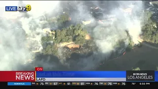 Crews battle San Pedro brush fire close to homes