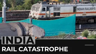 Probe into India rail disaster begins as train services resume