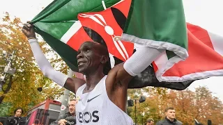 Eiud Kipchoge celebrates after running a sub 2 hour marathon