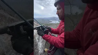 Drilling a bolt anchor for a new climb.