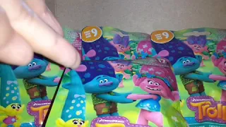 opening up Trolls dolls blind bags