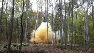 17 lbs tannerite under a pile of logs