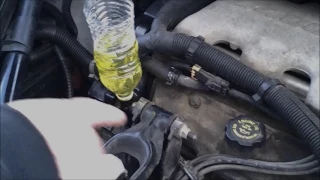 Removing air pockets in engine  with plastic bottle