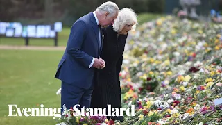 Charles and Camilla make emotional visit to floral tributes left in memory of Prince Philip