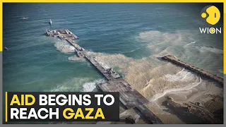 Israel-Hamas war: Humanitarian aid arrives on Gaza  shores through US-built pier | World News | WION
