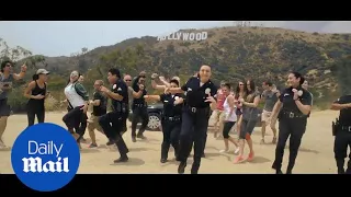 Tinseltown throwdown: LAPD take on Running Man Challenge - Daily Mail