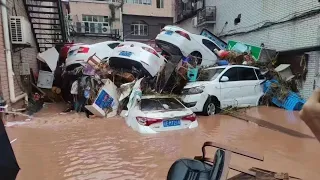 In China now! River bursts and streets are underwater after flash flood in Sichuan