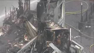 Oceanside Pier still smouldering one day after massive fire