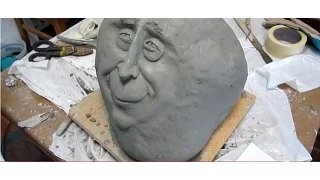 Face Stone Ferrocent Sculpture