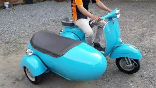 Vespa scooter piaggio with sidecar blue