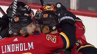 Flames erupt for five straight goals in 3rd period to stun Avalanche