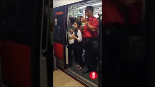 SMRT Staff happily eating on the train