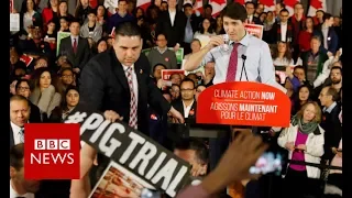 Trudeau heckled at climate change address - BBC News