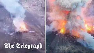 Russian armoured vehicle explodes after being hit by Ukrainian drone