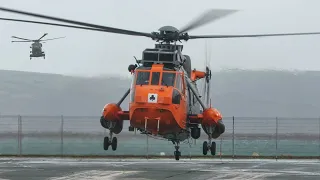 Royal Navy Merlin helicopters and a Sea King from HeliOps 🚁