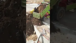 Dump truck unloading Dirt And Bulldozer Pushing Clearing Dirt