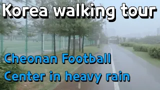 Walking in Korea. Walk around the Cheonan Football Center in heavy rain.