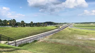 Brightline Bright Orange heading into Orlando International Airport