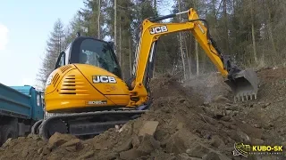 JCB 8085 ECO excavator digging rock and loading Tatra truck