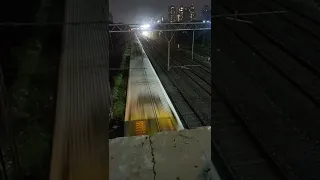 Mumbai local train indian railways station video from bridge at night