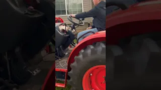 Grayson driving my brothers Kioti tractor. His first time driving a clutch