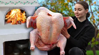 Ukrainian girl cooks 15 kg turkey in a wood burning oven in Village