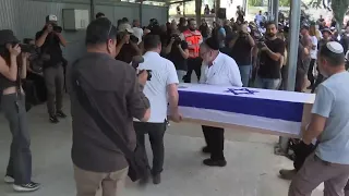 Parents speak at funeral held in Israel for Shani Louk, German-Israeli hostage killed by Hamas